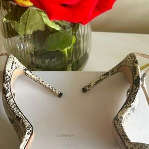 Up, up and away. Reach new style heights in the Snake-Embossed Leather Sandal.